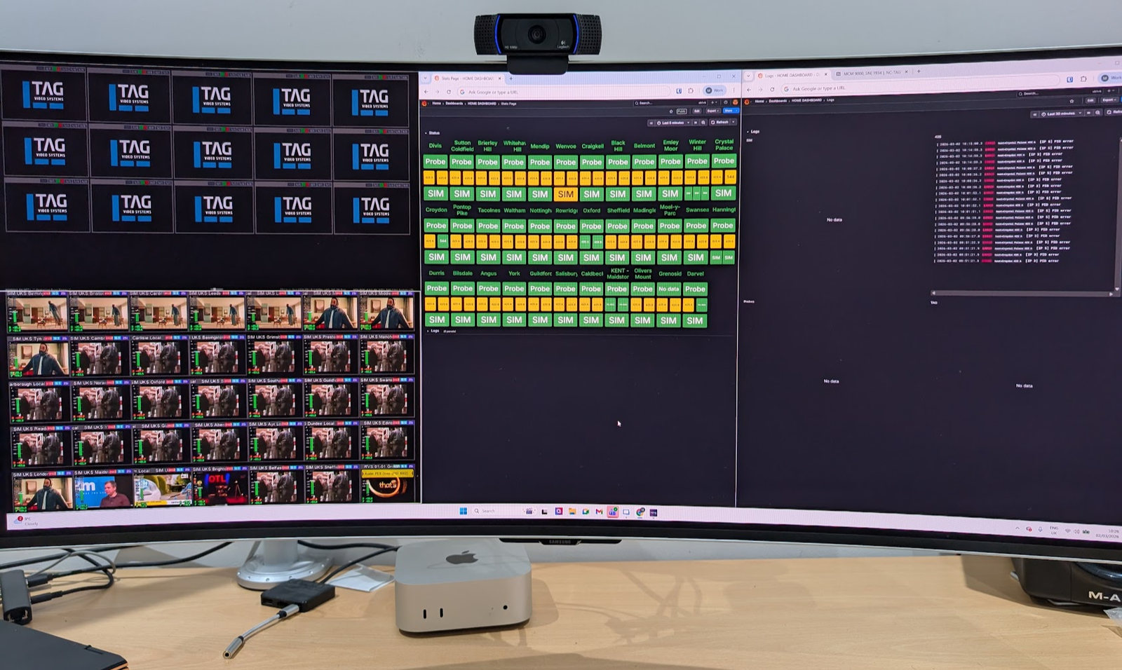An ultrawide monitor showing the multiviewer beside a status grid for every transmitter site.